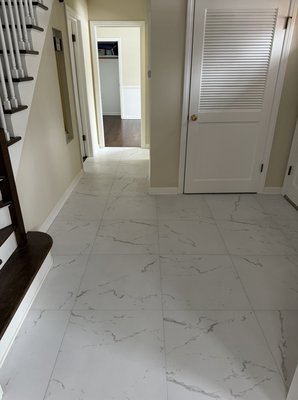Floor replacement - This remodel took place at the entrance of this beautiful home. We removed old screed, added 3/4 plywood and 1/4 hardie boards as tile backing and installed 24x24 porcelain.