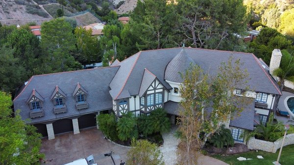 Custom Solution – Hexagon Roofing Completes Unique Project in Buena Park, CA - Hexagon Roofing recently completed a custom roof replacement for a large residential property in Buena Park, CA. The home’s unique design included turreted towers, steep slopes, and multiple intersecting rooflines—making this a technically demanding and highly detailed project.
Our team removed the existing roof system and installed new high-performance underlayment, carefully shaped to fit the home’s complex structure. From curved sections to tight valleys and elevated ridges, every transition was sealed and reinforced for long-term durability.
Architectural shingles were then installed with precision to complement the home’s design while ensuring protection from the elements. The final result is a roofing system that not only performs under pressure, but visually aligns with the character and craftsmanship of the property.
For custom roofing solutions in Buena Park, CA, Hexagon Roofing delivers quality-driven work built for unique homes. Custom Solution – Hexagon Roofing Completes Unique Project in Buena Park, CA - Hexagon Roofing recently completed a custom roof replacement for a large residential property in Buena Park, CA. The home’s unique design included turreted towers, steep slopes, and multiple intersecting rooflines—making this a technically demanding and highly detailed project.
Our team removed the existing roof system and installed new high-performance underlayment, carefully shaped to fit the home’s complex structure. From curved sections to tight valleys and elevated ridges, every transition was sealed and reinforced for long-term durability.
Architectural shingles were then installed with precision to complement the home’s design while ensuring protection from the elements. The final result is a roofing system that not only performs under pressure, but visually aligns with the character and craftsmanship of the property.
For custom roofing solutions in Buena Park, CA, Hexagon Roofing delivers quality-driven work built for unique homes.