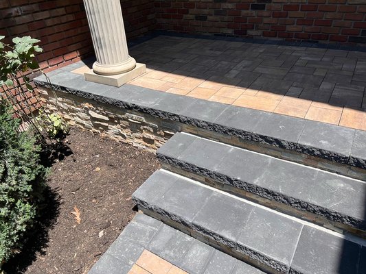 Blacktop driveway - New blacktop driveway with Belgium Block borders Cambridge apron Cambridge stoop with the vaneer stone facing Blacktop driveway - New blacktop driveway with Belgium Block borders Cambridge apron Cambridge stoop with the vaneer stone facing