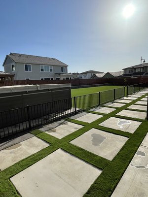Back yard remodel and design by us - We did a really big transformation on this back yard we did the synthetic grass and the big blocks the small 4 feet tall fence for the dog 🐶 and we put the fence and everything you see in this photo. Back yard remodel and design by us - We did a really big transformation on this back yard we did the synthetic grass and the big blocks the small 4 feet tall fence for the dog 🐶 and we put the fence and everything you see in this photo.