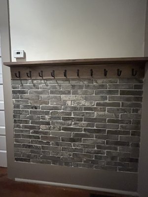 Brick tile chair rail, with walnut shelves - Remodeled hallway with brick tile chair rail, coat hooks, and re painting of trim walls and ceiling. Brick tile chair rail, with walnut shelves - Remodeled hallway with brick tile chair rail, coat hooks, and re painting of trim walls and ceiling.