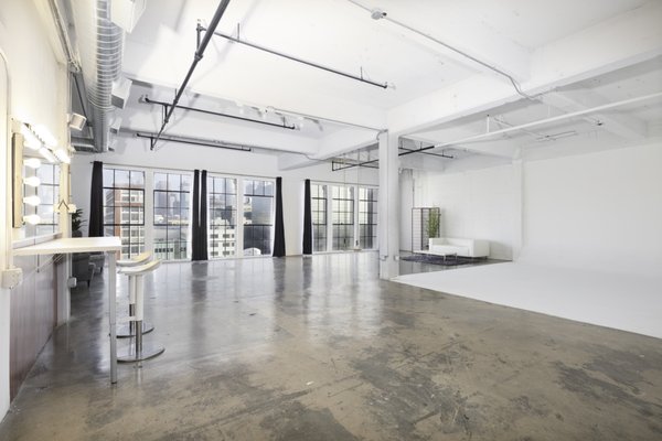 Studio A ($60/hr - 4 hour minimum) - Studio A is our 1300 sq/ft private studio, available for $60/hr (4 hour minimum)

Event Rates: Starting from $120/hr

Key Features:
-Freshly painted white hard-wall cyclorama
-Incredible sunset skyline city views
-West-facing floor to ceiling windows
-High gloss concrete floors
-12 foot ceilings
-Central AC
-Makeup station
-Clothing rack
-Bluetooth speaker
-2 couches, 2 chairs, and coffee table