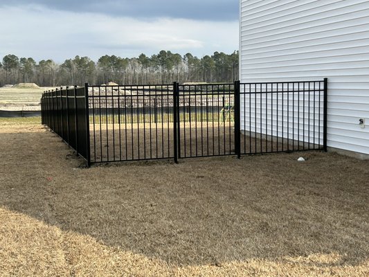 Black aluminum - This fence is black aluminum, perfect to keep children and pets enclosed and safe but also maintaining the customers view! Black aluminum - This fence is black aluminum, perfect to keep children and pets enclosed and safe but also maintaining the customers view!