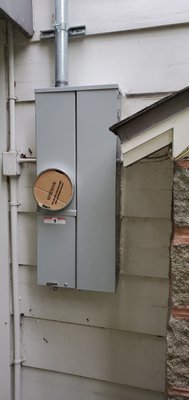 panel upgrade 100 to 200 amp - installing new 2 inch pipe run up side of house and installing new 200 amp meter panel combo.  New wire from weatherhead to panel.  difficult access only option extension ladder to roof.