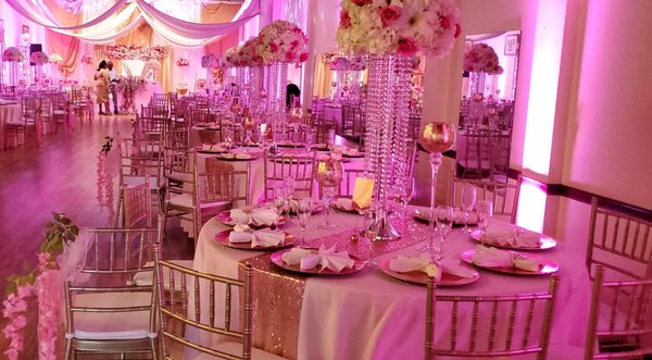 Greisy's Wedding - These photos are from a Pink, Gold and Rose Gold theme wedding at Rendezvous. This is a Venue and Decoration package we offer for only $3,500.00. It includes table arrangement and set up, sweetheart table, backdrop with flowers, table settings, cake table set up, buffet table set up, lighting ( focus lights & up lights )  and free consultation and planning with our in house planners and decorators. Each project is different, each bride has her own wedding dream, we are here to make it come true. Request a customized quote, and our event sales executives will get in touch with asap. Check the website at www.rendezvouscelebrations.com or chat with the owner, Mitzi at 301-661-5809.