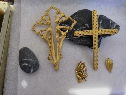 Custom 14k Yellow Gold Cross Necklace - This custom cross was a design from the mind of one of our customers. We took their idea, created a hand drawing, transferred the hand drawing into a CAD design, hand carved the praying hands, hand set the diamonds and fully assembled the cross. This entire project was all done from start to finish in our Allendale, NJ location. We can custom create any idea that you may have. Our ability to create wax models and CAD designs all in house gives us the ability to work with any budget.