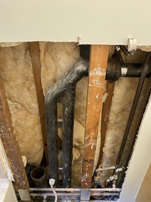 Cast Iron to PVC Stack Replacement - Cast Iron stack in the wall was cracked . Repaired with PVC.