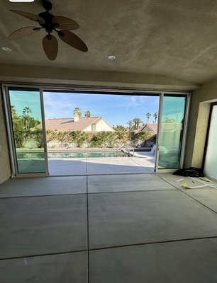 Removed standard siding, door and picture window and installed one four panel door to open up the indoor outdoor living space - The customer wanted to remove his existing standard sliding  door and make the opening larger and install one large four panel sliding door to make this space indoor outdoor living area. 
They love the open space and easy access to the pool.