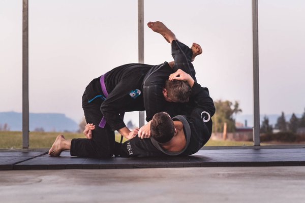 Brazilian Jiu-Jitsu - The art of folding clothes while somebody is in them….

Tactical hugging….

The physical game of chess where the body and mind must adapt, overcome, and ultimately subdue or submit your opponent….

In all seriousness, jiu jitsu is the art or skill of using leverage, timing, base, posture, and connection to defend, control, attack, and submit your opponent. It is also fun, addictive, ever-changing, and an excellent workout. At Higs Performance Academy we offer a robust program including training options in Gi and No-Gi for both those interested in training competitively or recreationally.

We have a top-notch group of coaches led by Head Coach, Byron Higinbotham who is currently a 2nd Degree Brazilian Jiu Jitsu Black Belt under Roy Dean. In addition, Coach Byron has studied many forms of the combat arts including having his 3rd Degree Black Belt in Taekwondo.

A positive training environment is important to us at Higs. Our goal is to provide a supportive, welcoming, skill-building, and fun environment for all. We ask all to leave ego at the door and come ready to work hard and be a good partner. If you can do that, we are sure you will quickly become part of our Higs family!