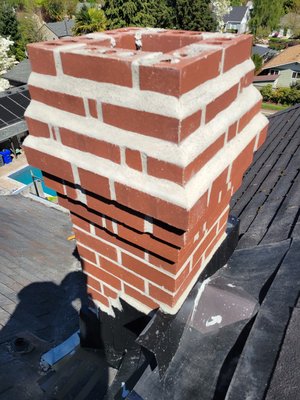The Legacy Towers - Historical Chimney Restorations 2025 - At Chimney Restoration Services LLC, we were honored to contribute to preserving the legacy of this historical building by constructing two remarkable faux chimneys. These chimneys were designed to maintain the building’s compliance with historical preservation standards, combining traditional craftsmanship with modern needs. Though they won’t house any fireplaces, they perfectly emulate the aesthetics of genuine brickwork, leaving another satisfied client proud of their restored piece of history.