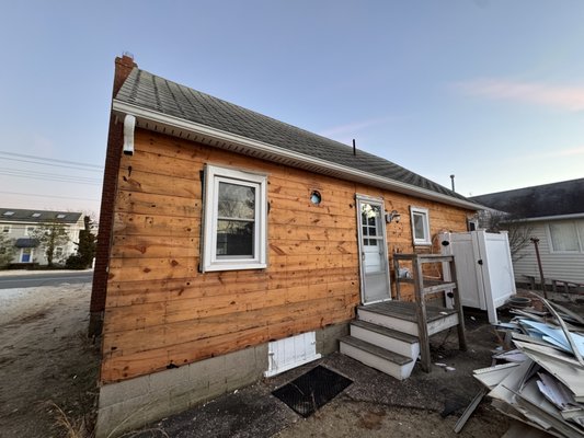 Siding Removal - Asbestos Siding Removed at Surf city ready to demo