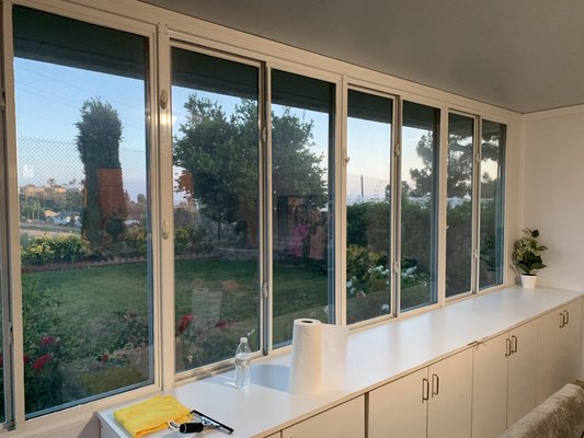 A significant reduction in heat for a backyard extension intended to serve as a TV room. - A 5% Visible Light Transmission (VLT) dual reflective film—such as the DR Night View.
A strong exterior reflectivity that creates a mirror-like appearance during the day, with a neutral, low-reflective carbon or ceramic interior. Blocks up to 99% of UV rays and significantly reduces solar energy absorbance A significant reduction in heat for a backyard extension intended to serve as a TV room. - A 5% Visible Light Transmission (VLT) dual reflective film—such as the DR Night View.
A strong exterior reflectivity that creates a mirror-like appearance during the day, with a neutral, low-reflective carbon or ceramic interior. Blocks up to 99% of UV rays and significantly reduces solar energy absorbance
