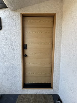 Replacement of the exterior door along with the door frame. - We removed the old door along with the entire door frame, installed a protective flashing tape inside the door opening, and then installed the new door frame together with the new exterior door. We also installed all new hardware, including the hinges, handle set, deadbolt, door sweep, and the bottom seal and the threshold. In addition, we installed a new threshold and applied a protective clear coat to the door for durability.
