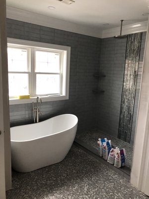 Full Bathroom Remodel - Full bathroom remodel - blue rustic subway on walls with glass chase and 4 pie shelves - freestanding tub - penny tiles on floor Full Bathroom Remodel - Full bathroom remodel - blue rustic subway on walls with glass chase and 4 pie shelves - freestanding tub - penny tiles on floor