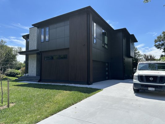 Monarch Homes New Build - This new home was built in the new modern style that is recently popular in Vienna and the DC suburbs. The home has a dramatic look and would simply not have looked as good with standard bare concrete for the driveway and walkway. We finished the garage and coated the driveway and walkway with our patented material. This material is very resilient to the elements and really completed the look for this modern home. Monarch Homes New Build - This new home was built in the new modern style that is recently popular in Vienna and the DC suburbs. The home has a dramatic look and would simply not have looked as good with standard bare concrete for the driveway and walkway. We finished the garage and coated the driveway and walkway with our patented material. This material is very resilient to the elements and really completed the look for this modern home.
