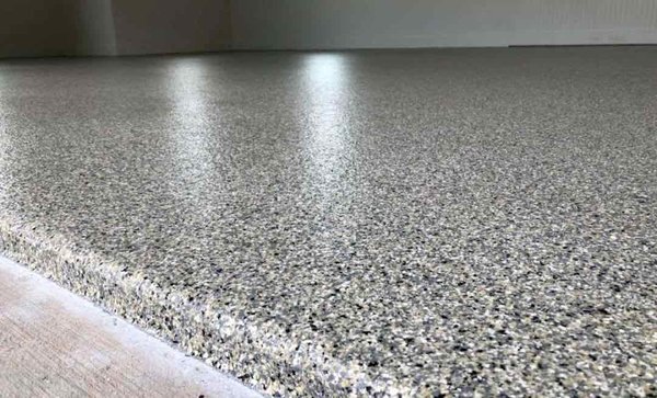 Garage Floor Coating - This floor was outdated and had multiple stains and cracks. We sealed and coated this floor to give it this slip resistant coating that looks phenomenal and will hold up to years of wear and tear! Garage Floor Coating - This floor was outdated and had multiple stains and cracks. We sealed and coated this floor to give it this slip resistant coating that looks phenomenal and will hold up to years of wear and tear!