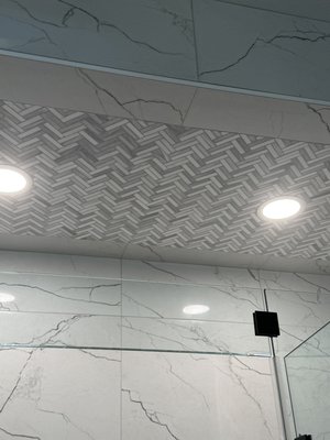 Luxury Shower Remodel - Complete custom shower remodel featuring large-format porcelain tile, a herringbone ceiling design, recessed lighting, and a frameless glass enclosure. Built with precision, quality, and attention to every detail. Luxury Shower Remodel - Complete custom shower remodel featuring large-format porcelain tile, a herringbone ceiling design, recessed lighting, and a frameless glass enclosure. Built with precision, quality, and attention to every detail.