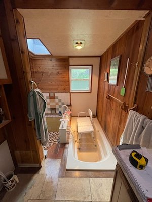 Oakland Bathroom - We transformed a custom built 1971 bathroom with a sunken shower and jacuzzi set into tile into a more modern full open shower wheelchair accessible bathroom. With a custom shower tray this 52sqft shower will be a comfortable and beautiful space for the homeowners.