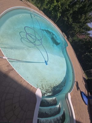 Pool Cleaning - After masonry work was done on the brick surround, sand and debris ended up in the pool, leaving the water cloudy and green. We performed a full clean to remove the debris and restore the water to crystal clear condition. Pool Cleaning - After masonry work was done on the brick surround, sand and debris ended up in the pool, leaving the water cloudy and green. We performed a full clean to remove the debris and restore the water to crystal clear condition.