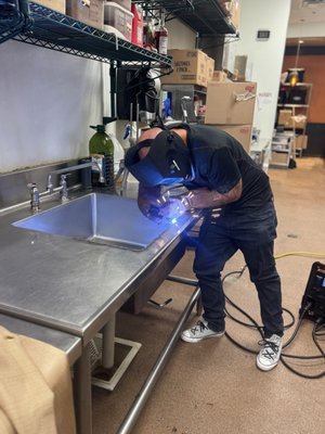 Welding in Orlando, FL - This sinks had cracks around the inside edge. Rather than replacing the entire sink, we welded this and 4 others to extend the life.