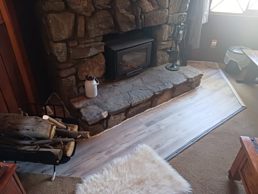 Fireplace remodel - This remodel was to a fireplace where the owner was afraid of the carpet catching on fire due to having the fireplace too close to the carpet. We came up with replacing the carpet with vinyl flooring around the fireplace preventing any fire hazards Fireplace remodel - This remodel was to a fireplace where the owner was afraid of the carpet catching on fire due to having the fireplace too close to the carpet. We came up with replacing the carpet with vinyl flooring around the fireplace preventing any fire hazards