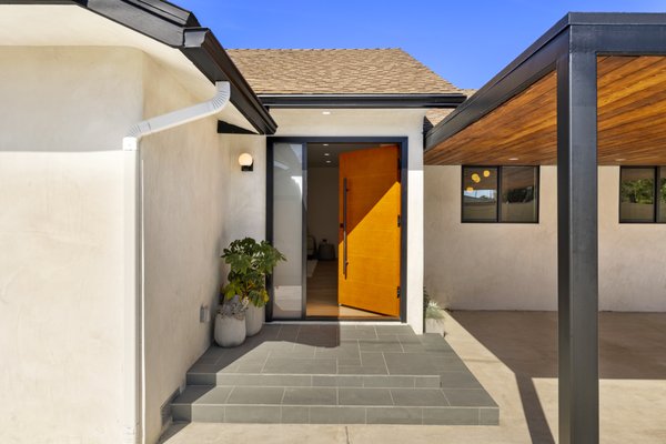 Contemporary Full House Remodeling by SB Construction & Remodeling in Winnetka, CA - Contemporary design, warm natural materials, and thoughtful craftsmanship define this full house remodeling project by SB Construction & Remodeling in Winnetka, CA. We approached this renovation as a complete transformation, carefully redesigning each space to create a cohesive home where every room flows naturally into the next. By combining clean architectural lines, organic textures, and a timeless neutral palette, we created an interior that feels bright, welcoming, and effortlessly modern.
The living and dining area establishes the home's open-concept layout with soaring vaulted ceilings, expansive black-framed windows, and wide-plank white oak flooring that carries warmth throughout the interior. Recessed LED lighting and contemporary fixtures enhance the natural light, while the simple color palette allows the architectural details and wood finishes to become the focal point of the space. The seamless connection between the living room, dining area, and kitchen creates an inviting environment that's equally suited for everyday living and entertaining.
The kitchen serves as the centerpiece of the renovation, blending refined design with practical functionality. Custom white oak cabinetry, accented with matte black hardware, is paired with a striking waterfall quartz island featuring bold marble-inspired veining that immediately draws attention. Matching quartz countertops, floating wood shelves, premium stainless steel appliances, designer sconces, and a vertical wood slat accent wall introduce layers of texture while maintaining the clean, contemporary aesthetic. Every material was selected to create a kitchen that feels sophisticated, durable, and timeless.
The home's bathrooms, bedrooms, and flexible living spaces continue the same contemporary design language with custom oak vanities, oversized porcelain tile, modern plumbing fixtures, wide-plank flooring, updated lighting, and carefully coordinated finishes. Soft neutral tones, natural wood textures, and abundant natural light create comfortable spaces that feel both refined and functional. An additional flex room provides the versatility to serve as a home office, creative workspace, or private retreat while maintaining the same cohesive style found throughout the home.
To complete the renovation, subtle exterior improvements including smooth white stucco, black-framed windows, a custom natural wood entry door, and refreshed landscaping create a welcoming first impression that reflects the contemporary character found inside.
From the open-concept living areas and custom kitchen to the thoughtfully finished private spaces, every aspect of this full home remodel reflects our commitment to quality craftsmanship and carefully selected materials. If you're planning a full house remodel, kitchen renovation, bathroom remodeling, or complete interior renovation, SB Construction & Remodeling delivers custom remodeling solutions designed with lasting quality, timeless style, and attention to every detail. Contemporary Full House Remodeling by SB Construction & Remodeling in Winnetka, CA - Contemporary design, warm natural materials, and thoughtful craftsmanship define this full house remodeling project by SB Construction & Remodeling in Winnetka, CA. We approached this renovation as a complete transformation, carefully redesigning each space to create a cohesive home where every room flows naturally into the next. By combining clean architectural lines, organic textures, and a timeless neutral palette, we created an interior that feels bright, welcoming, and effortlessly modern.
The living and dining area establishes the home's open-concept layout with soaring vaulted ceilings, expansive black-framed windows, and wide-plank white oak flooring that carries warmth throughout the interior. Recessed LED lighting and contemporary fixtures enhance the natural light, while the simple color palette allows the architectural details and wood finishes to become the focal point of the space. The seamless connection between the living room, dining area, and kitchen creates an inviting environment that's equally suited for everyday living and entertaining.
The kitchen serves as the centerpiece of the renovation, blending refined design with practical functionality. Custom white oak cabinetry, accented with matte black hardware, is paired with a striking waterfall quartz island featuring bold marble-inspired veining that immediately draws attention. Matching quartz countertops, floating wood shelves, premium stainless steel appliances, designer sconces, and a vertical wood slat accent wall introduce layers of texture while maintaining the clean, contemporary aesthetic. Every material was selected to create a kitchen that feels sophisticated, durable, and timeless.
The home's bathrooms, bedrooms, and flexible living spaces continue the same contemporary design language with custom oak vanities, oversized porcelain tile, modern plumbing fixtures, wide-plank flooring, updated lighting, and carefully coordinated finishes. Soft neutral tones, natural wood textures, and abundant natural light create comfortable spaces that feel both refined and functional. An additional flex room provides the versatility to serve as a home office, creative workspace, or private retreat while maintaining the same cohesive style found throughout the home.
To complete the renovation, subtle exterior improvements including smooth white stucco, black-framed windows, a custom natural wood entry door, and refreshed landscaping create a welcoming first impression that reflects the contemporary character found inside.
From the open-concept living areas and custom kitchen to the thoughtfully finished private spaces, every aspect of this full home remodel reflects our commitment to quality craftsmanship and carefully selected materials. If you're planning a full house remodel, kitchen renovation, bathroom remodeling, or complete interior renovation, SB Construction & Remodeling delivers custom remodeling solutions designed with lasting quality, timeless style, and attention to every detail.