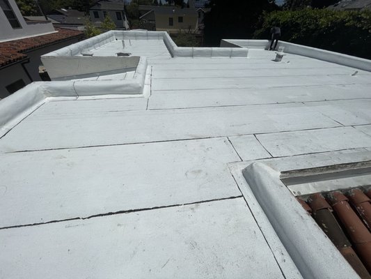 New Reflective White Torch Applied Roof - We removed 5 layers of old roofing to the wood deck. We fastened new cover board to the roof deck, adhered Elastoflex base and torched down new Polyfresko reflective white cap sheet New Reflective White Torch Applied Roof - We removed 5 layers of old roofing to the wood deck. We fastened new cover board to the roof deck, adhered Elastoflex base and torched down new Polyfresko reflective white cap sheet