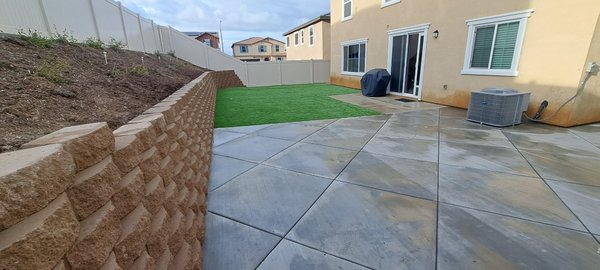 Backyard Artificial Turf Installation with Modern Concrete Design and Keystone Retaining Wall in Riverside CA - Visit our Website to Get your Free Quote for Landscape/Hardscape Design and Installation. Backyard Artificial Turf Installation with Modern Concrete Design and Keystone Retaining Wall in Riverside CA - Visit our Website to Get your Free Quote for Landscape/Hardscape Design and Installation.