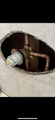 Delta Shower Valve Installation - Client had called us out for water coming out of bottom of the faceplate.
After removing the escutcheons we noticed that the valve was installed improperly and not up to code.
(Previous plumber had used supply lines inside of the wall instead of using hard copper piping)