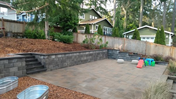 Retaining Wall - Maximize usable space. By creating level terraces or tiers, retaining walls allow you to maximize the use of your backyard, making it easier to create gardens, seating areas, or other outdoor living spaces. It also offers benefactions such as erosion control, improved drainage, enhanced aesthetics, structural support, increased property value, easier maintenance, safety, and customization options to suit your landscape needs and preferences. Retaining Wall - Maximize usable space. By creating level terraces or tiers, retaining walls allow you to maximize the use of your backyard, making it easier to create gardens, seating areas, or other outdoor living spaces. It also offers benefactions such as erosion control, improved drainage, enhanced aesthetics, structural support, increased property value, easier maintenance, safety, and customization options to suit your landscape needs and preferences.