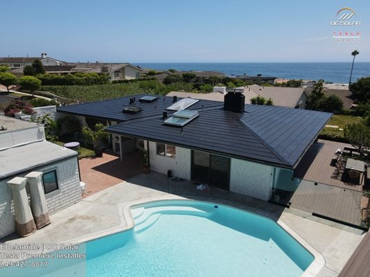 Newport Beach Tesla Solar Roof Installation - OC Solar recently completed a remarkable installation of a Tesla Solar Roof in Newport Beach, showcasing our dedication to quality and innovation. The sleek design of the Tesla Solar Roof seamlessly integrated with the home's architecture, providing exceptional energy efficiency and aesthetic appeal. Our Tesla Solar Roof certified technicians ensured a flawless installation, adhering to the highest safety and industry standards. The homeowner is now enjoying significant savings on their energy bills and contributing to a greener future. Contact us today for a free consultation and discover how we can help you harness the power of the sun. Newport Beach Tesla Solar Roof Installation - OC Solar recently completed a remarkable installation of a Tesla Solar Roof in Newport Beach, showcasing our dedication to quality and innovation. The sleek design of the Tesla Solar Roof seamlessly integrated with the home's architecture, providing exceptional energy efficiency and aesthetic appeal. Our Tesla Solar Roof certified technicians ensured a flawless installation, adhering to the highest safety and industry standards. The homeowner is now enjoying significant savings on their energy bills and contributing to a greener future. Contact us today for a free consultation and discover how we can help you harness the power of the sun.