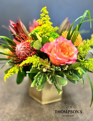 New Fall Design - New flower arrangement design for autumn 2025. In a gold metal container with exotic pincushions, free spirit roses, solidago, sunset safari, hydrangea and hypericum berries. New Fall Design - New flower arrangement design for autumn 2025. In a gold metal container with exotic pincushions, free spirit roses, solidago, sunset safari, hydrangea and hypericum berries.