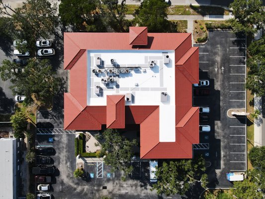 Sarasota Downtown Commercial Roof Replacement - Commerical buiidling where multiple different business offices/suites. comprimised tile roof around the perimeter and old failing flat roof section in the middle. replaced with Worthouse metal roofing system and new GAF TPO flat roof system to protect these businesses and refresh the building. Sarasota Downtown Commercial Roof Replacement - Commerical buiidling where multiple different business offices/suites. comprimised tile roof around the perimeter and old failing flat roof section in the middle. replaced with Worthouse metal roofing system and new GAF TPO flat roof system to protect these businesses and refresh the building.