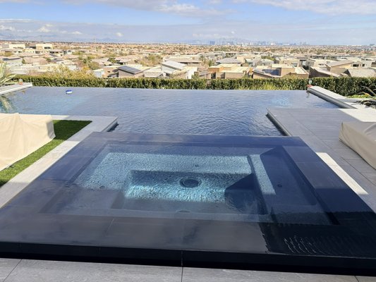 Customers Beautiful View - One of our favorite pools — an infinity-edge design with a stunning Las Vegas backdrop. This dark finish requires extra attention to detail, and we take the right steps to help prevent calcium buildup and keep the water and surfaces looking pristine. Customers Beautiful View - One of our favorite pools — an infinity-edge design with a stunning Las Vegas backdrop. This dark finish requires extra attention to detail, and we take the right steps to help prevent calcium buildup and keep the water and surfaces looking pristine.