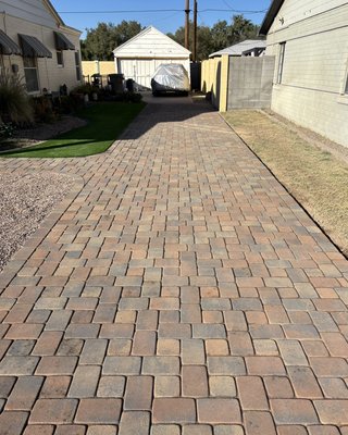 Central Phoenix Driveway - In this historic district home in central phoenix we excavated and removed old concrete and bermuda grass to then add 3 inches of abc material for compaction to ensure a long lasting driveway. We then added a thin bed of sand to lay the pavers over it with the beautiful k pattern.