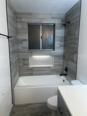 Full bathroom remodel - This was a very outdated bathroom that needed to be updated we had a lot of fun designing this bathroom with a custom build in for shelving and a custom vanity to fit the space. When ever you walk in to the bathroom it feels like you walked into the spa on a long hard day of work