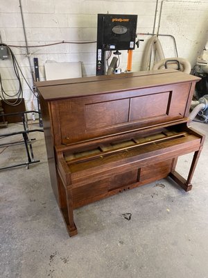 100 Year Old Piano Cabinet Restoration - The customer of this instrument has great memories of sitting around this player piano when his family would get together for holidays and special occasions. He wanted to bring new life back into the instrument so that his kids could have the same memories he had growing up. The owner of this piano was starstruck when he saw the his piano was figured walnut underneath the blacked finish. 100 Year Old Piano Cabinet Restoration - The customer of this instrument has great memories of sitting around this player piano when his family would get together for holidays and special occasions. He wanted to bring new life back into the instrument so that his kids could have the same memories he had growing up. The owner of this piano was starstruck when he saw the his piano was figured walnut underneath the blacked finish.