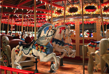 Carousel - Children's Birthday Parties - Make your child's birthday an enchanting adventure at the Bushnell Park Carousel! Nestled in the heart of Hartford's historic Bushnell Park, our whimsical venue offers the perfect backdrop for a magical celebration. Let the laughter of carousel rides and the joy of timeless fun create unforgettable memories for your little one and their friends. With charming party packages and personalized touches, our dedicated team ensures a stress-free and delightful experience for all. Choose the Bushnell Park Carousel for your next kids' birthday party and watch imaginations soar!
There are two birthday stations available each with two 8’ tables and bench seating.
Cost: $160 for two hours when the carousel is open to the public. Unlimited rides for 10 children and 2 adults. Small bag of popcorn and plastic tablecloths provided for guests. Maximum capacity is 30 people – adults and children. Any additional guests at the party, including adults, is $7pp and includes rides, whether they ride the carousel or not. NOTE – this rate is not available during non-public hours. Carousel - Children's Birthday Parties - Make your child's birthday an enchanting adventure at the Bushnell Park Carousel! Nestled in the heart of Hartford's historic Bushnell Park, our whimsical venue offers the perfect backdrop for a magical celebration. Let the laughter of carousel rides and the joy of timeless fun create unforgettable memories for your little one and their friends. With charming party packages and personalized touches, our dedicated team ensures a stress-free and delightful experience for all. Choose the Bushnell Park Carousel for your next kids' birthday party and watch imaginations soar!
There are two birthday stations available each with two 8’ tables and bench seating.
Cost: $160 for two hours when the carousel is open to the public. Unlimited rides for 10 children and 2 adults. Small bag of popcorn and plastic tablecloths provided for guests. Maximum capacity is 30 people – adults and children. Any additional guests at the party, including adults, is $7pp and includes rides, whether they ride the carousel or not. NOTE – this rate is not available during non-public hours.