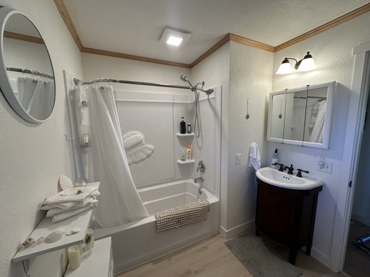 Bathroom Remodel adding a tub into a small space. - The customer wanted to add a tub into a small bathroom that had a shower enclosure that was badly in need of an upgrade. We opened up an adjacent wall and expanded a closet space in the office to create a place for the install of a new shower/tub combination. This opened up the bathroom space and makes it feel much more user friendly. Other upgrades including moving and upgrading the plumbing, adding a bath fan, and installing new drywall, flooring and finish trim. Our clients are really happy with the finished result!