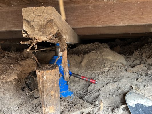 Foundation repair - Here you can see one of our favorite jobs we received the pleasure of doing in Fredericksburg on a 150 year old farmhouse! The house settled so severely we had to dig over 125' of tunnel to get access for our beams. We then proceeded to lift house over 8 inches out of the dirt!