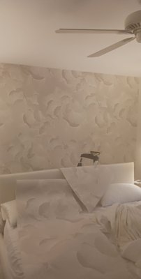 Wallpaper Installation - This wallpaper install project took some time to ensure no bubbles and to align design of wallpaper for seamless appearance. Wallpaper provided by client. Not seen on picture is the plastic cover to protect flooring from any glue spills.