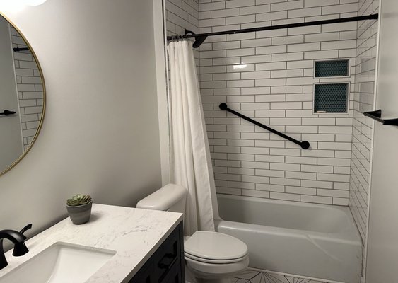 Bathroom Remodel - This was a remodel done to an old bathroom in a 1970s home. All new plumbing was added, a wall was taken out, all new tile and fixtures. Bathroom Remodel - This was a remodel done to an old bathroom in a 1970s home. All new plumbing was added, a wall was taken out, all new tile and fixtures.