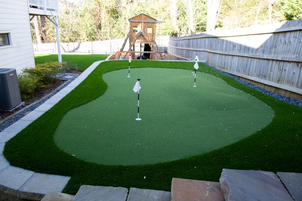 Putting Green Installations - Whether you're looking for an outdoor activity that's fun for the entire family or you're working to perfect your short game, an artificial turf custom putting green is always a good idea!
Southern Turf Co. offers a wide selection of the industry’s most advanced products that mimic the look and feel of a course quality green. We install everything from elite-grade products to casual and family friendly putting surfaces that everyone can enjoy!
Contact us today for a FREE estimate! Putting Green Installations - Whether you're looking for an outdoor activity that's fun for the entire family or you're working to perfect your short game, an artificial turf custom putting green is always a good idea!
Southern Turf Co. offers a wide selection of the industry’s most advanced products that mimic the look and feel of a course quality green. We install everything from elite-grade products to casual and family friendly putting surfaces that everyone can enjoy!
Contact us today for a FREE estimate!