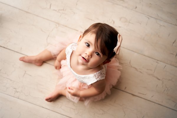 First Birthday Session - This First birthday session was so much fun. Mom messaged me with inspiration photos and I'm so glad I could bring it to life. During the session I take simple portraits that can be hang on the wall, gifted to grandparents or use for school projects. Later I take pictures on a decorated set without the cake. We play song, dance and sing. When is time for the cake I let parents take short videos to document the special day. Lots of fun and lots of mess! Clean up session follows the cake smash. Babies love splashing in the water and give the most beautiful smiles and funniest faces. First Birthday Session - This First birthday session was so much fun. Mom messaged me with inspiration photos and I'm so glad I could bring it to life. During the session I take simple portraits that can be hang on the wall, gifted to grandparents or use for school projects. Later I take pictures on a decorated set without the cake. We play song, dance and sing. When is time for the cake I let parents take short videos to document the special day. Lots of fun and lots of mess! Clean up session follows the cake smash. Babies love splashing in the water and give the most beautiful smiles and funniest faces.