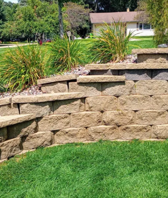 Retaining Wall Resurrection - Our retaining wall resurrection services restores beaten, overgrown and weathered walls to the functional eye drawing appearance that they should be.
A sturdy and well-designed retaining wall is essential for maintaining the integrity of your landscape. Opting for a professional service ensures that your project is suitable for many seasons to come by giving it a refreshing check up to ensure it's longevity.
Issues like soil erosion can be effectively mitigated through proper stone and or block replacement or repair when needed safeguarding both your property and nearby structures. Additionally, expert assistance in the restoration can guarantee durability and provides longer life and prevents future issues that may arise from inadequate building practices that are outdated
Every landscape is unique; therefore, trusting professionals that Invest in quality workmanship is a must so Don’t compromise on the safety or style of your outdoor space; ensure it stands strong with an expertly restored retaining wall. Retaining Wall Resurrection - Our retaining wall resurrection services restores beaten, overgrown and weathered walls to the functional eye drawing appearance that they should be.
A sturdy and well-designed retaining wall is essential for maintaining the integrity of your landscape. Opting for a professional service ensures that your project is suitable for many seasons to come by giving it a refreshing check up to ensure it's longevity.
Issues like soil erosion can be effectively mitigated through proper stone and or block replacement or repair when needed safeguarding both your property and nearby structures. Additionally, expert assistance in the restoration can guarantee durability and provides longer life and prevents future issues that may arise from inadequate building practices that are outdated
Every landscape is unique; therefore, trusting professionals that Invest in quality workmanship is a must so Don’t compromise on the safety or style of your outdoor space; ensure it stands strong with an expertly restored retaining wall.
