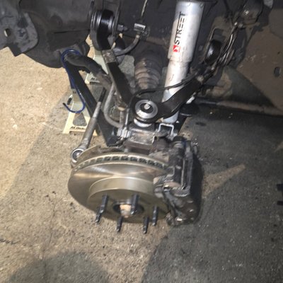 2004 Cadillac Escalade front end repair - We completed a front end repair on this Escalade. Consisting of new front hubs, brake pads and rotors inner and outer tie rods, upper and lower control A arms, and an alignment and a nearby shop for completion. call us today.