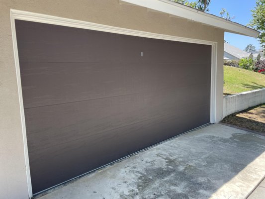 Garage Door Replacement - This garage door was getting old. The customer decided to go for a new replacement with a different color to more closely match the style of their detached garage. Garage Door Replacement - This garage door was getting old. The customer decided to go for a new replacement with a different color to more closely match the style of their detached garage.