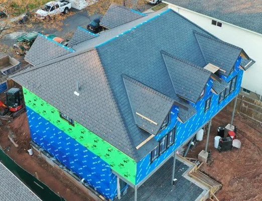 New Construction Roof Installation – Staten Island, NY - We recently completed a full roof installation for a newly constructed single-family home in Staten Island. From the initial site walk-through to the final cleanup, this project highlights our commitment to quality craftsmanship, clear communication, and reliable service.

Phase 1: Planning & Preparation

Since this was new construction, we began by reviewing the architectural plans and checking that the roof framing was done to code. We coordinated with the builder to confirm all specifications and timelines.

The client wanted a durable roofing system with a clean look, efficient ventilation, and long-term weather protection. After reviewing options, we agreed on architectural asphalt shingles, synthetic underlayment, a ridge vent system, and high-performance flashing.

Phase 2: Underlayment & Ventilation

We installed premium synthetic underlayment across the roof deck. This material provides better protection than traditional felt paper and resists water, tears, and mold. It acts as a backup shield against moisture under the shingles.

Proper ventilation is essential, especially for new homes. We installed soffit vents and a continuous ridge vent to ensure balanced airflow in the attic, which reduces moisture buildup, helps energy efficiency, and extends the roof’s lifespan.

Phase 3: Shingle Installation

The client selected GAF Timberline HDZ architectural shingles in Charcoal. These shingles are highly rated for their durability, wind resistance, and attractive finish. They also offer a limited lifetime warranty from the manufacturer.

We installed the shingles using a staggered pattern for strength and appearance, following all manufacturer guidelines. Extra care was taken in valleys, around ridges, and at transitions to make sure everything was properly sealed and aligned.

Phase 4: Flashing & Waterproofing

We installed aluminum drip edges on all eaves and rakes to direct water into the gutters and protect the roof’s edges. Around the chimney and walls, we used step flashing and high-quality sealants. All pipe boots were secured and sealed to prevent future leaks.

Although this was a new home with no previous roof to tear off, we maintained a clean and organized job site. Our crew followed safety protocols, used fall protection gear, and worked efficiently to stay on schedule.

Final Steps & Inspection

Once the roof was fully installed, we completed a detailed inspection to verify all shingles, flashings, and vents were properly installed. Everything passed the city inspection on the first try.

We walked the homeowner through the finished roof and explained the materials used and the warranties provided. They received a written workmanship warranty from us and manufacturer coverage from GAF.

Client Feedback:

The homeowner was very pleased with both the process and the result. They appreciated our fast turnaround, honest communication, and the overall quality of work. The finished roof not only enhanced the curb appeal of their new home but also gave them confidence that their investment was protected for the long term.

Materials Used:

Shingles: GAF Timberline HDZ (Charcoal)

Underlayment: Premium synthetic waterproof barrier

Ventilation: Continuous ridge vent & soffit vents

Flashing: Aluminum drip edge, step flashing

Pipe boots: Lead and rubber with sealant

Warranties: Manufacturer + Workmanship coverage

Why Choose Us for New Builds in Staten Island?

At Best Roof Contracting Group, we specialize in residential roofing and take pride in delivering roofs built to last. Whether you’re replacing an old roof or starting from scratch, our team is experienced, licensed, and ready to work with your builder or architect to bring your vision to life.

We use quality materials, follow best practices, and communicate every step of the way. With us, you’re not just getting a roof—you’re getting peace of mind.