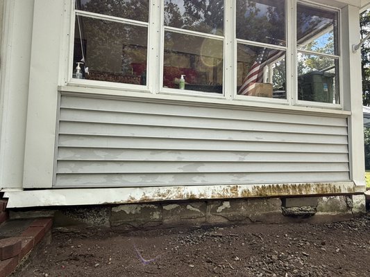 Masonry! - They used to have a huge bush in front of the house but they removed it so the foundation got exposed. Not biggie for NWS! Masonry! - They used to have a huge bush in front of the house but they removed it so the foundation got exposed. Not biggie for NWS!