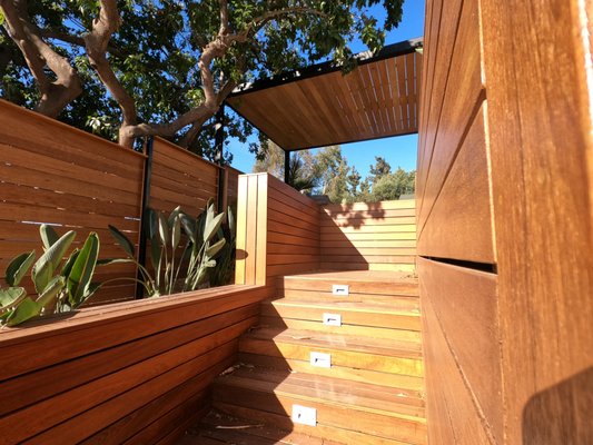 ipe decking, borneo fencing, metal framed gates/Pergola, customized outdoor kitchen - A Complete wooden Backyard Remodel 
Turned out Incredible!
